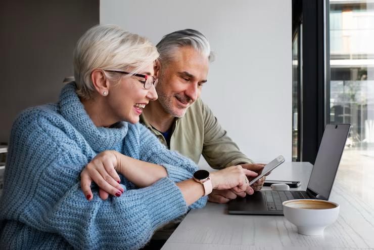 A couple reviewing Medicare enrollment details together.