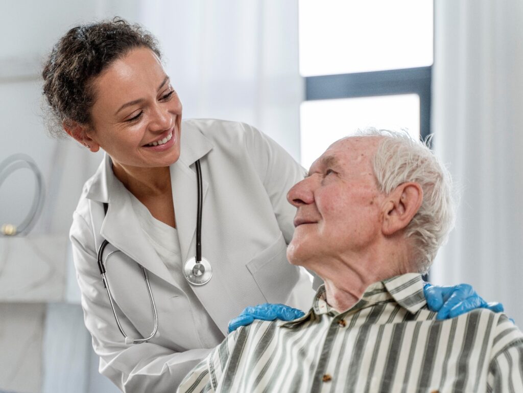 A doctor explaining in-home care options to senior man under Medicare