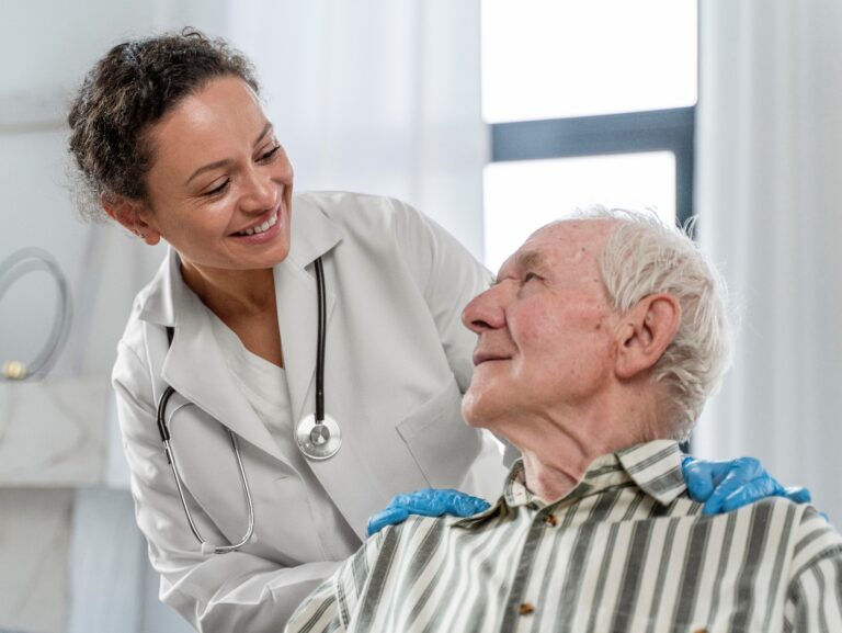 A doctor explaining in-home care options to senior man under Medicare