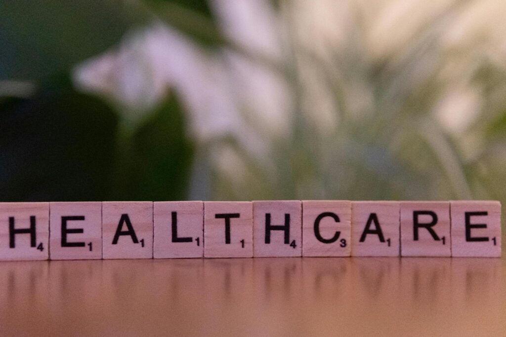 scrabble tiles spelling out “healthcare.”