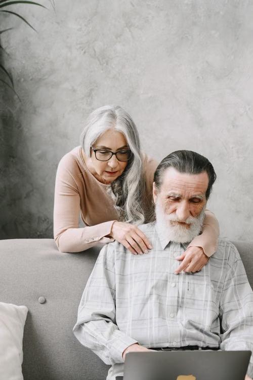 A senior couple checks their insurance plan.